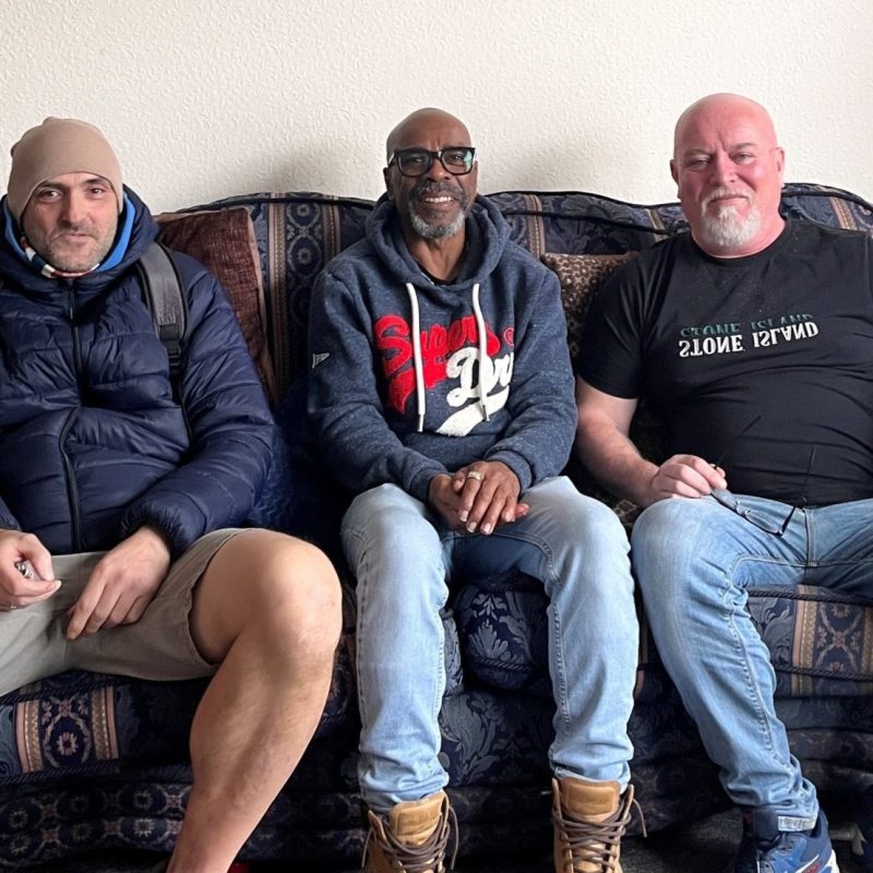 Gary, Kevin and Shane sat on a sofa.