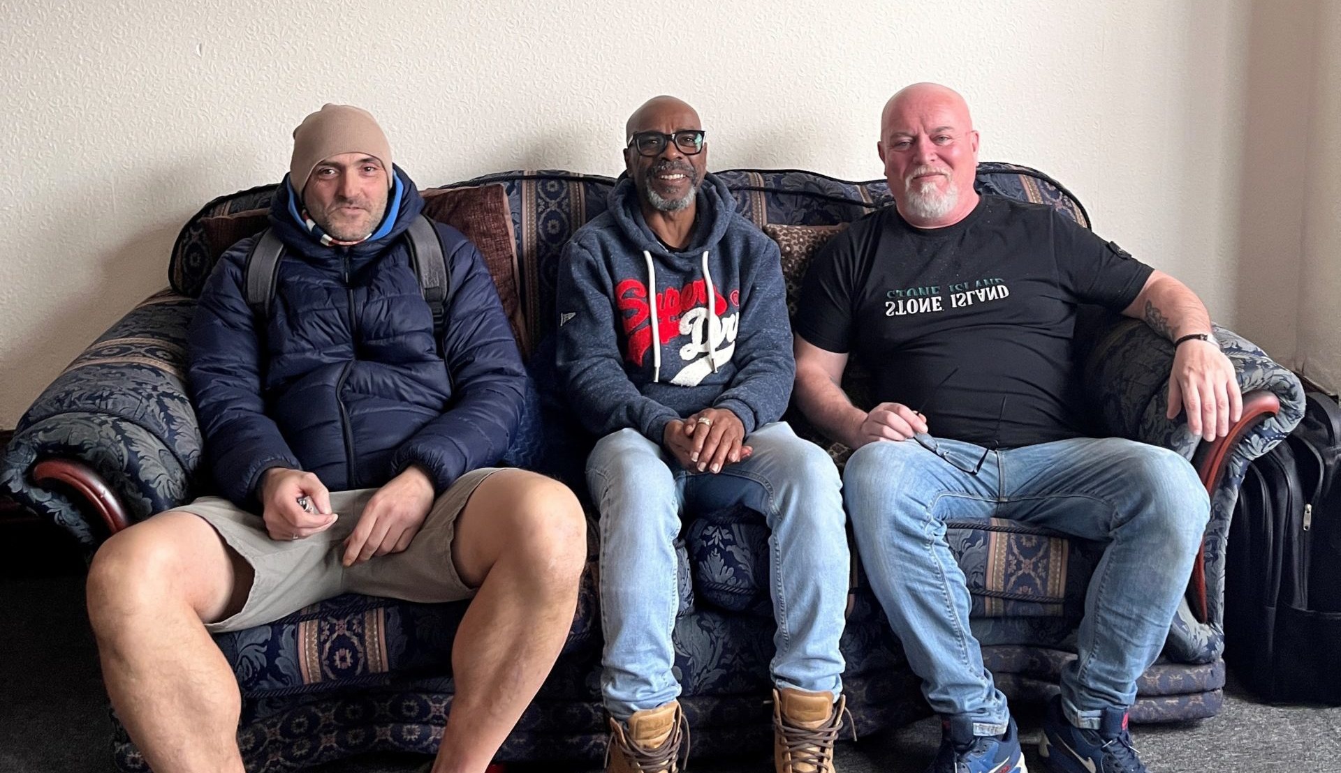 Gary, Kevin and Shane sat on a sofa.